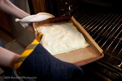 Transferring dish to the oven.