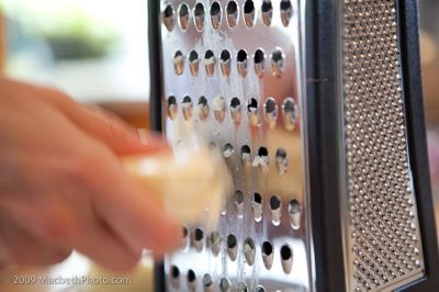 Close up of grating cheese.