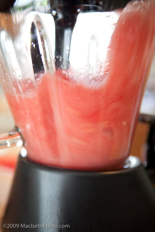 Blending the watermelon to create watermelon juice.