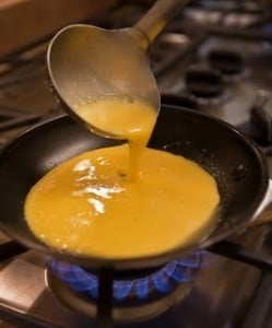 pouring omelet