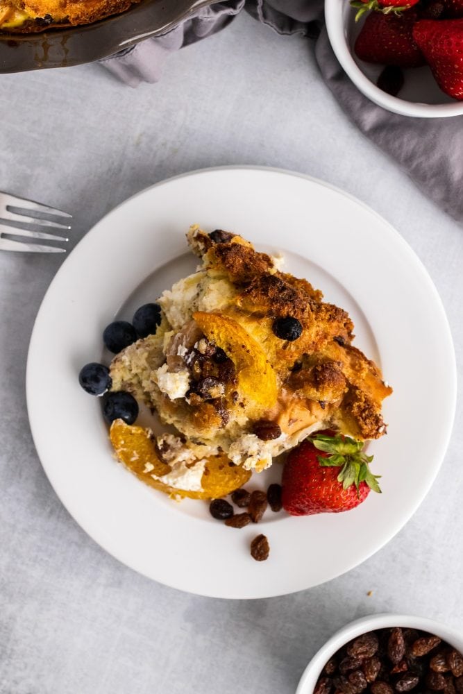 Overhead shot of slice of bread pudding on a plate.