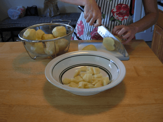 My hands chopping potatoes.
