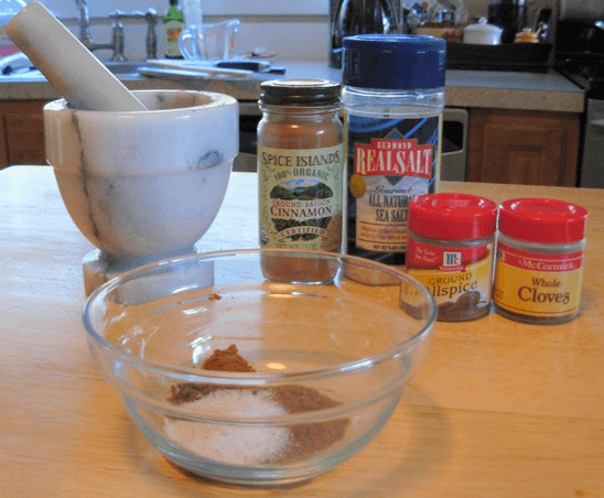 Mixing spices in a small glass bowl.