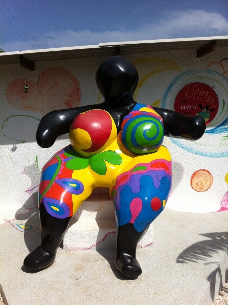 Chichi sculpture in Curacao with colorfully painted clothes
