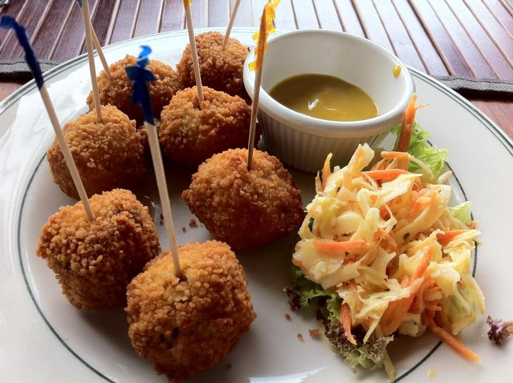 bitterballen in curacao with a side of mustard and slaw
