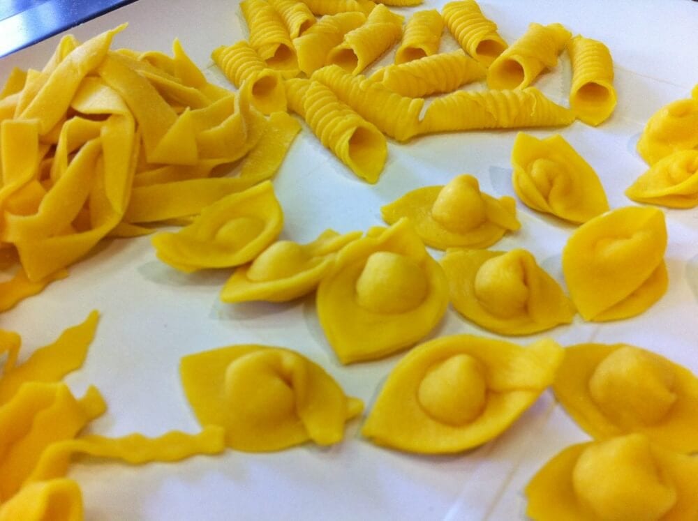 A plate of several types of fresh handmade pasta.