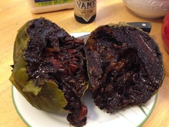 Black sapote cut in half.