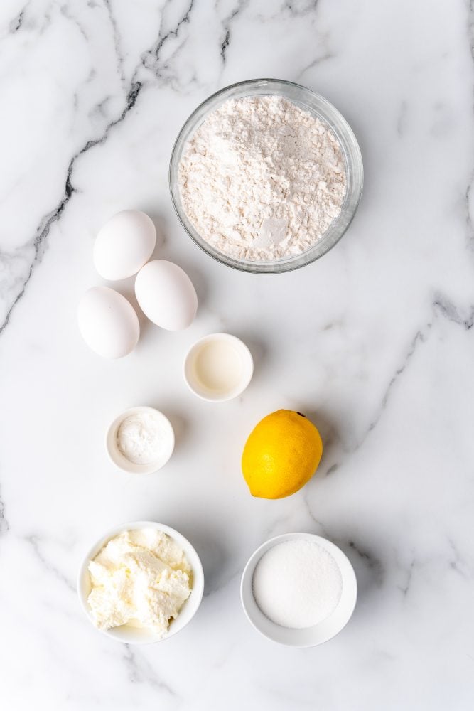 Ingredients to make lemon ricotta pancakes: 3 eggs 1/4 cup sugar 1 small lemon, zested and juiced 2 tsp baking powder 1 1/2 cups flour, sifted 3/4 cups ricotta 1/2 teaspoon lemon oil