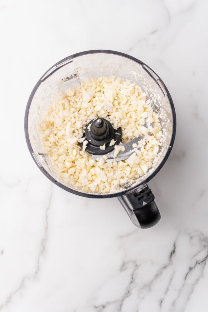 cauliflower finely chopped in a food processor so that it is the size of rice.