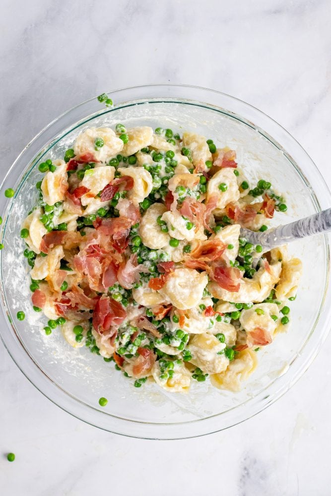 Overhead look of mixing all the ingredients together in a glass bowl.