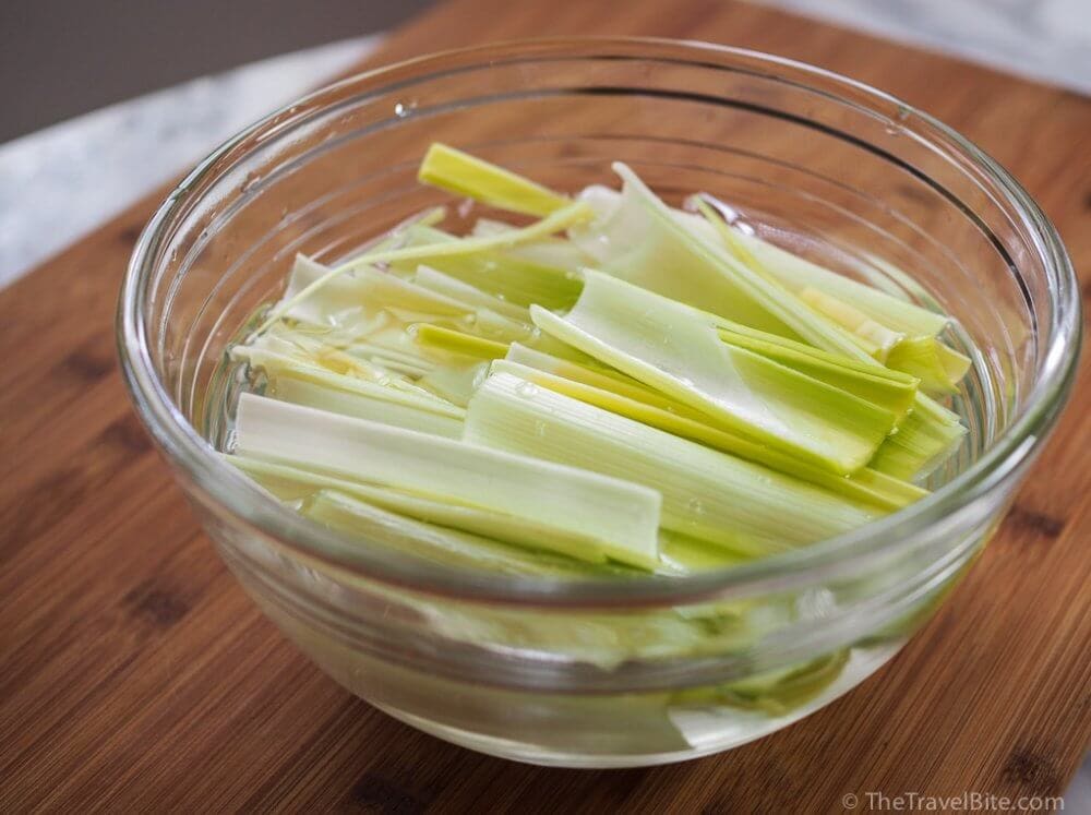 Chopped leeks soaking in water to remove the dirt.