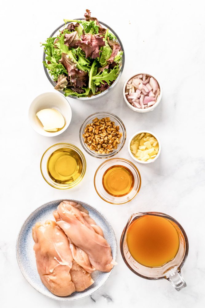 ingredients for apple cider chicken salad: lettuce, shallots, walnuts, butter, olive oil, honey, garlic, chicken, apple cider