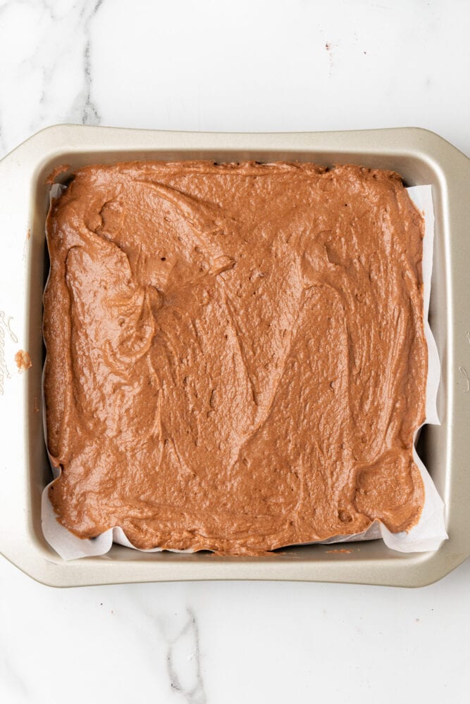 mocha brownie batter in a square baking pan