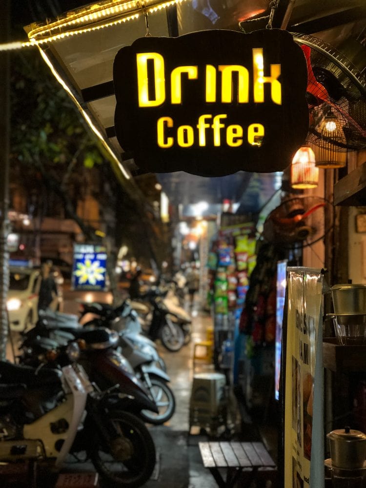 a sign that says "Drink Coffee"