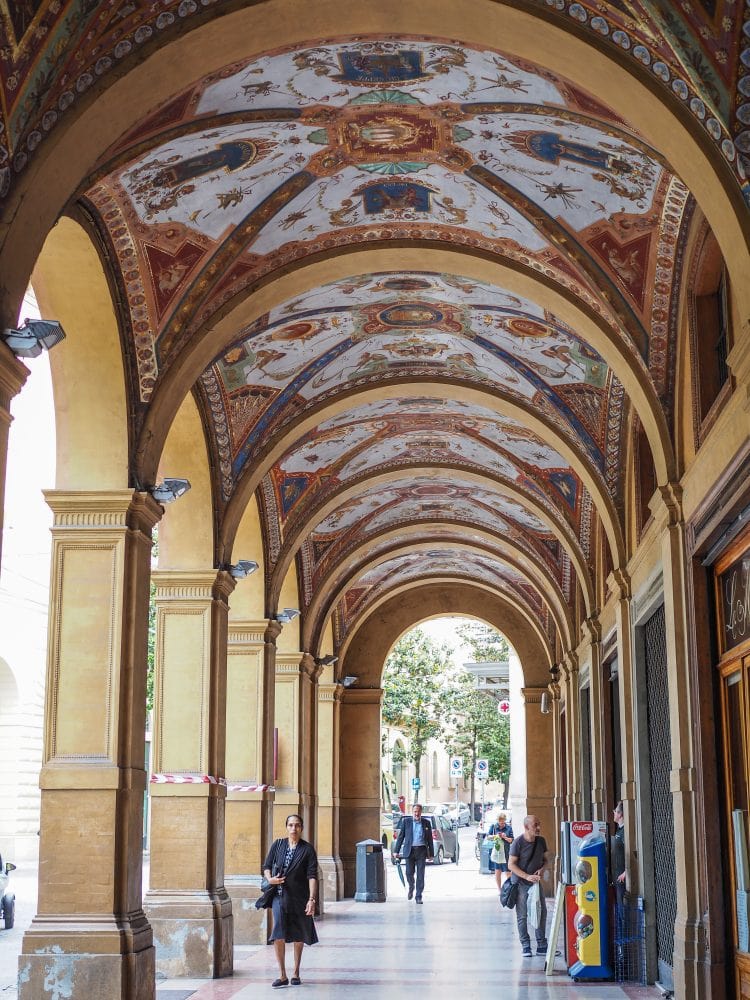 Some of Bologna's porticoes with painted ceilings with blue crests.