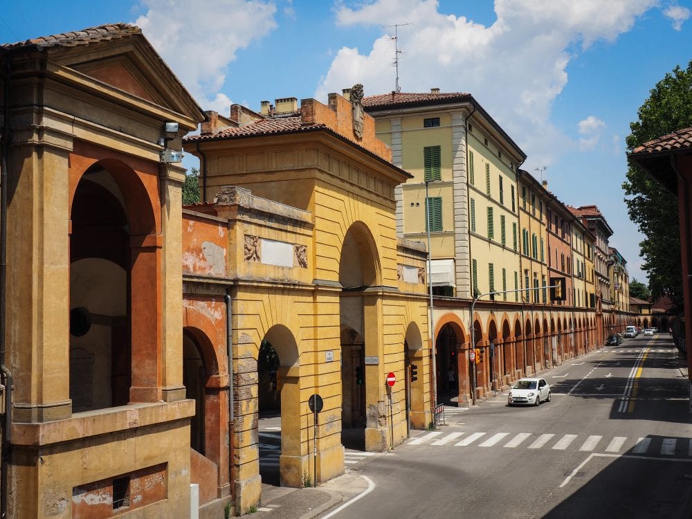 A photo of Bologna's porticoes leading outside of The Sanctuary of the Madonna of San Luca.
