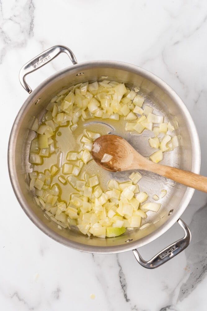 Cooking onions in butter in a stainless steel soup pot