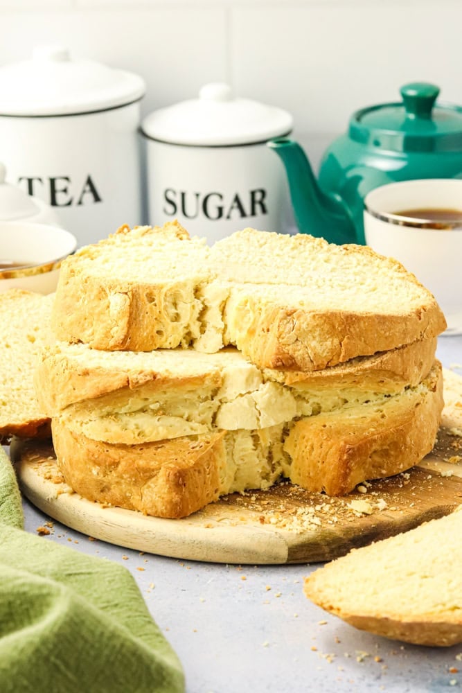 slices of Irish soda bread stacked on a wood board