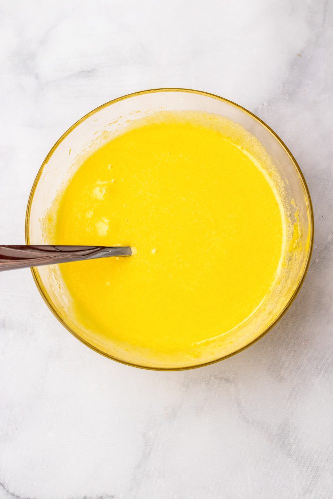 egg yolks and sugar blended together to looks smooth and bright yellow