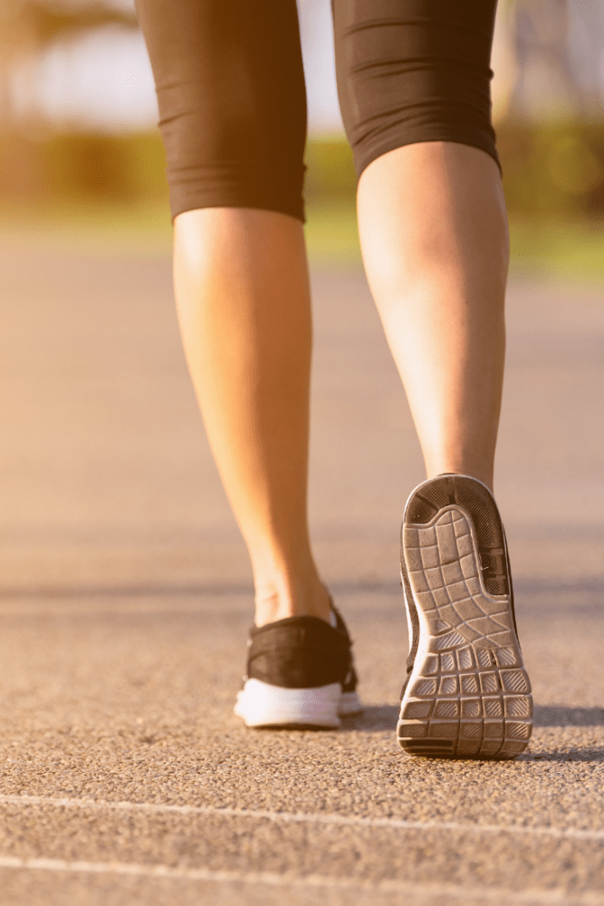 Photo of woman's athletic shoes as she's about to walk.