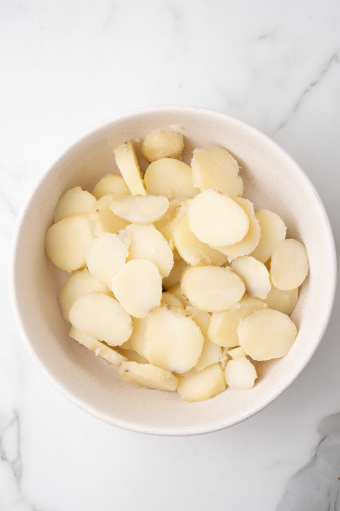 cooked potatoes, peeled and sliced into coin shaped rounds