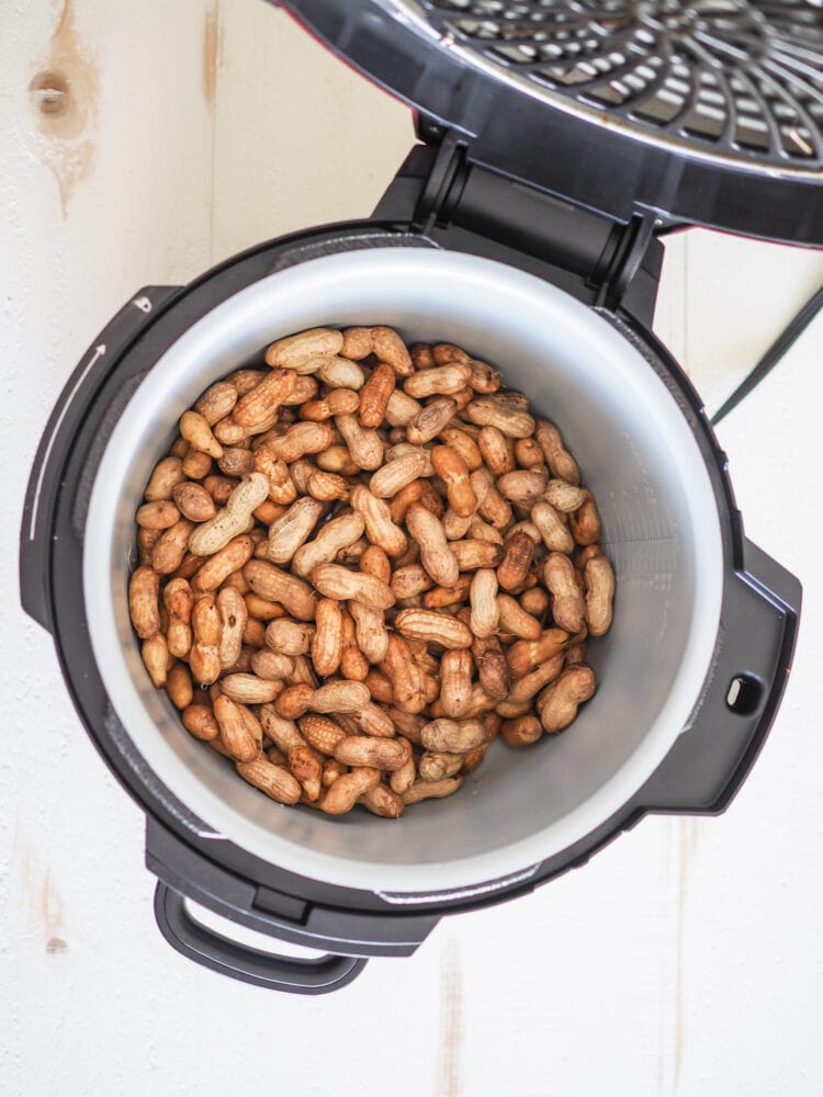 Boiled peanuts in a pressure cooker before cooking.