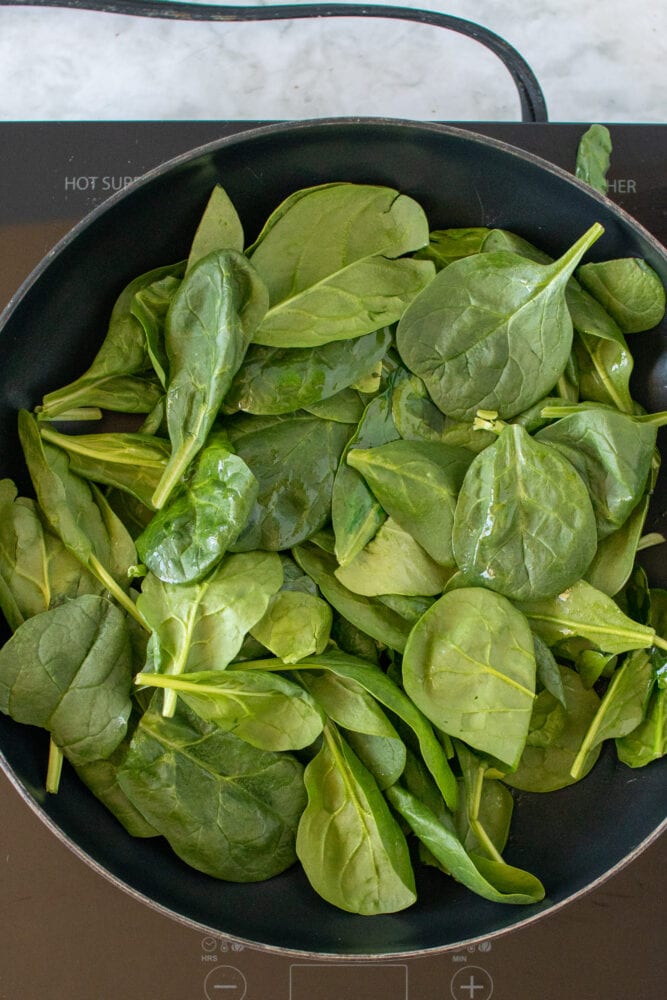 Overhead shot of cooking spinach.