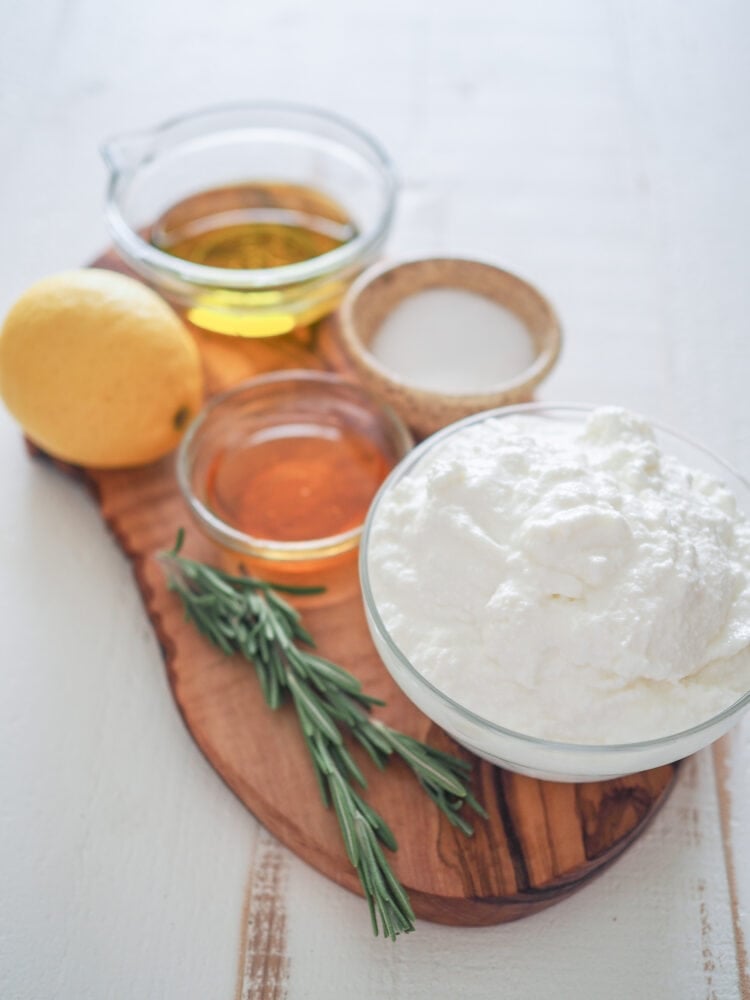 Whipped Ricotta Dip Ingredients: ricotta cheese, honey, olive oil, salt, lemon, and sprigs of rosemary for topping.