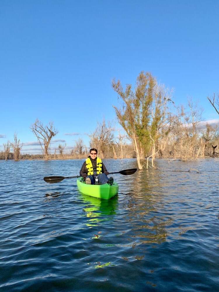 Pete in a green kayak on an oxbow lake just outside of Natchez.