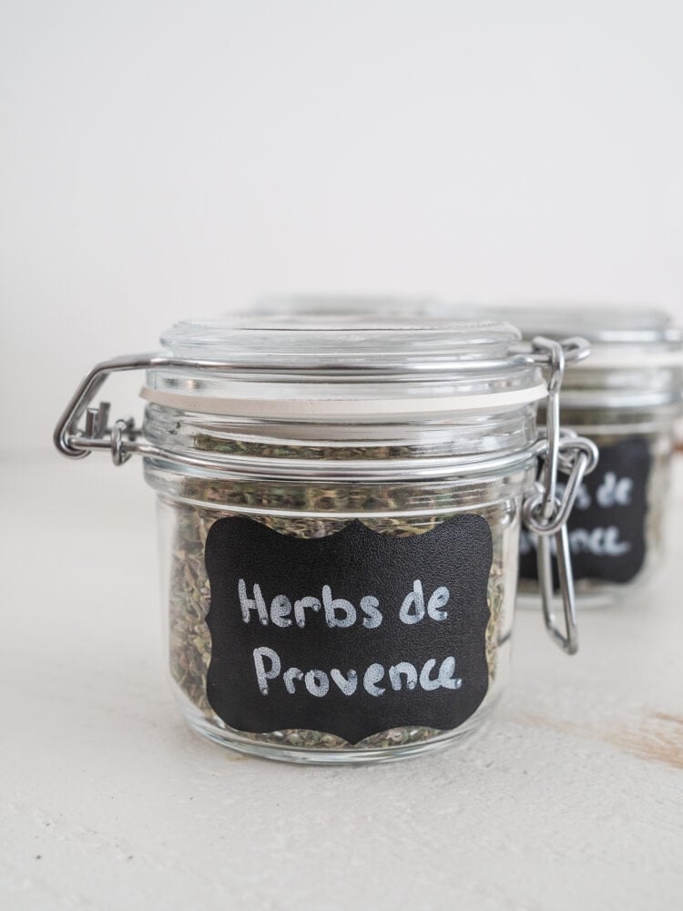Glass jar sealed with clamp lid and labeled with Herbs de Provence.