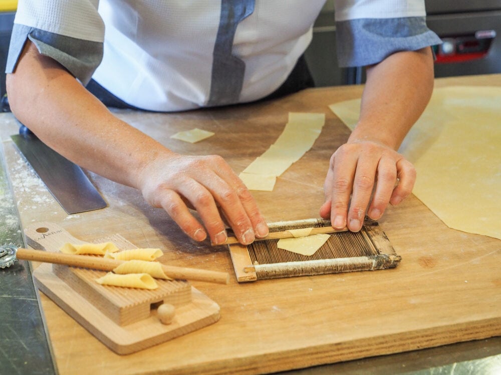 Rolling out different shapes of pasta.