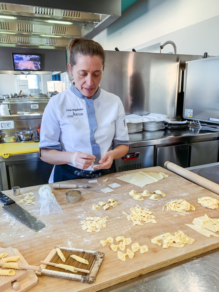 Carla demonstrating different types of pasta shapes.