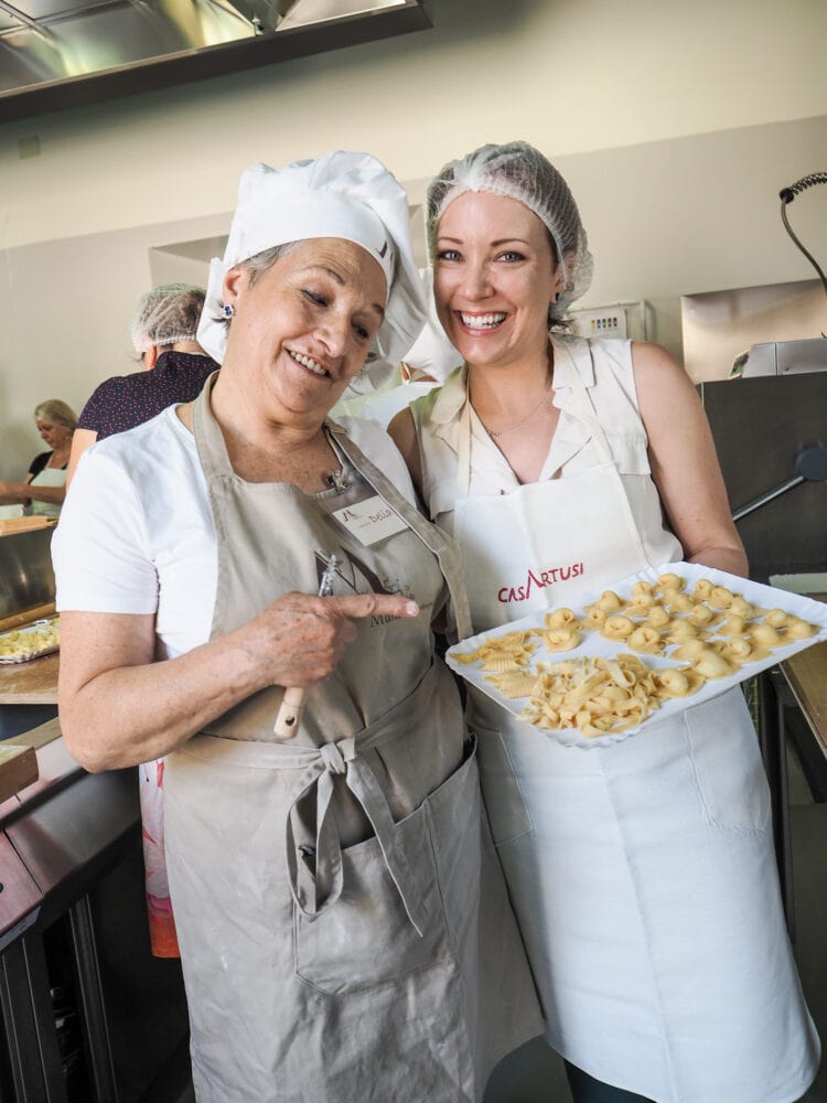 Rachelle with her instructor, Delia, holding finished pasta she made at the Casa Artusi Cooking School