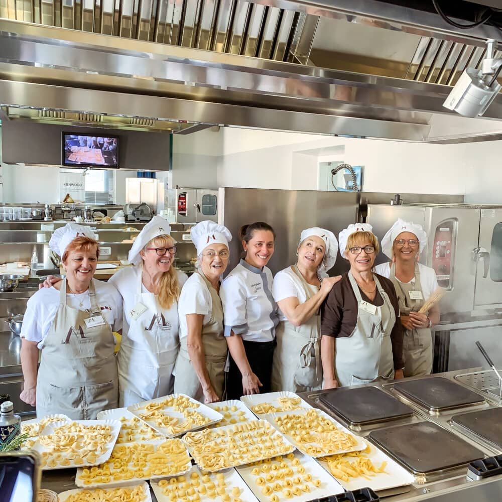 The "mariettes" (aka instructors) all lined up for an end-of-class photo at Casa Artusi Cooking School.