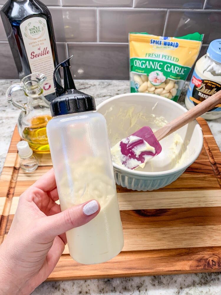 A squeeze bottle filled with homemade aioli.