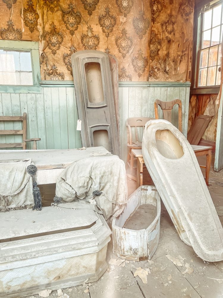Child sized coffins with a face window inside the Bodie funeral home.