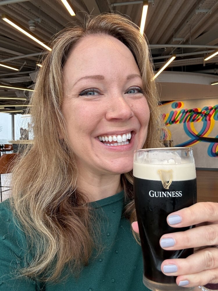 Rachelle sipping a half pint of Guinness in Dublin.