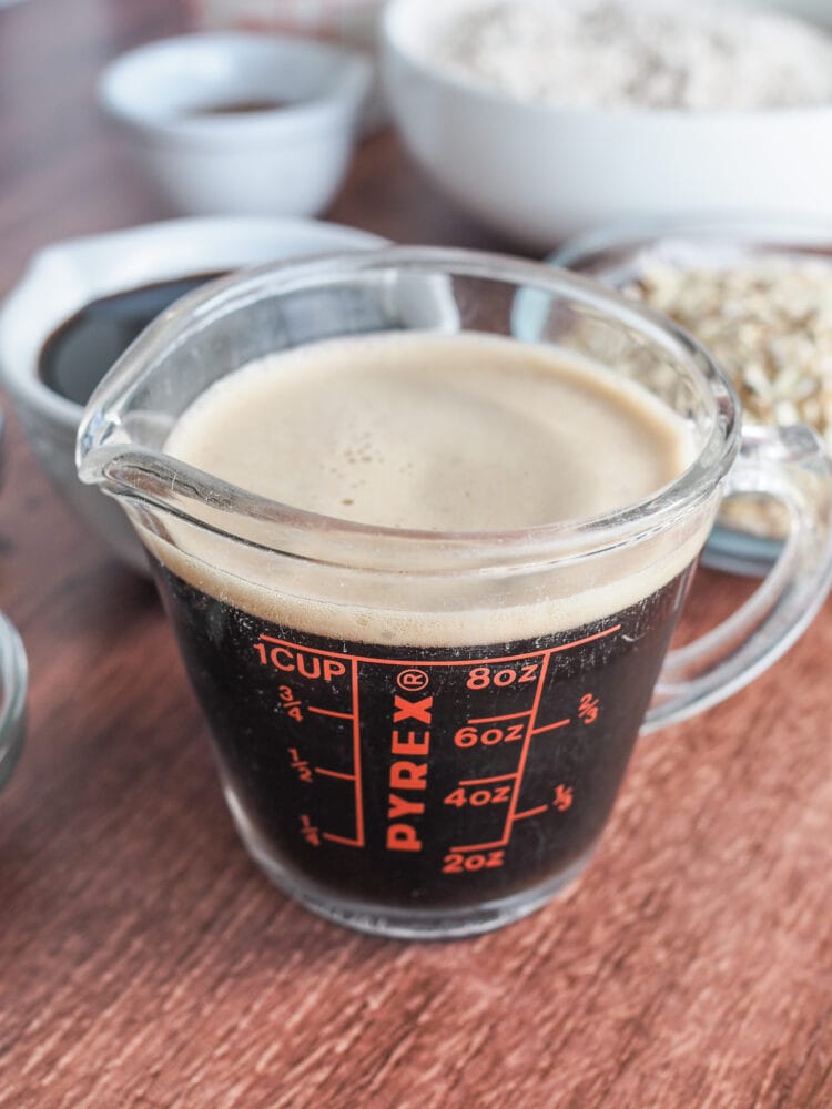 pre-measured dark beer in a measuring cup