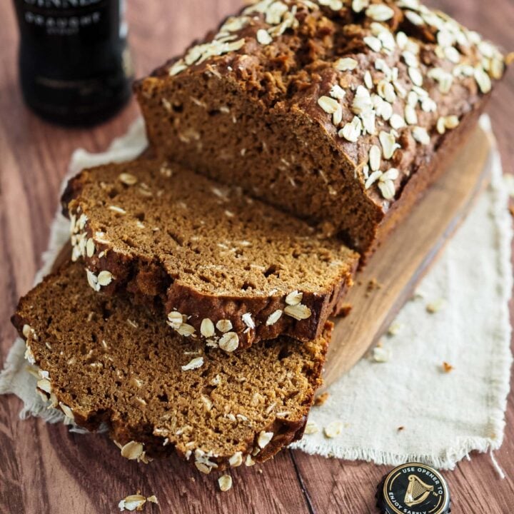 Sliced Irish brown bread with a bottle of Guinness