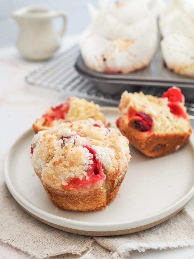 Cranberry orange muffins on a plate.
