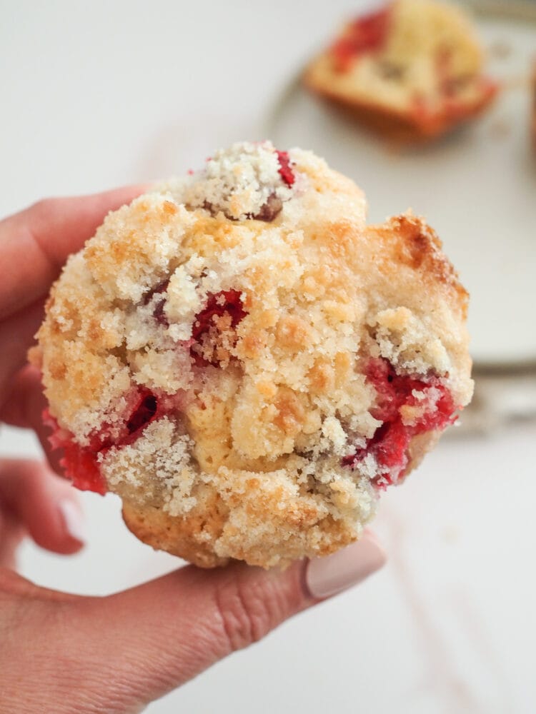 Cranberry orange muffin with crumble on top.