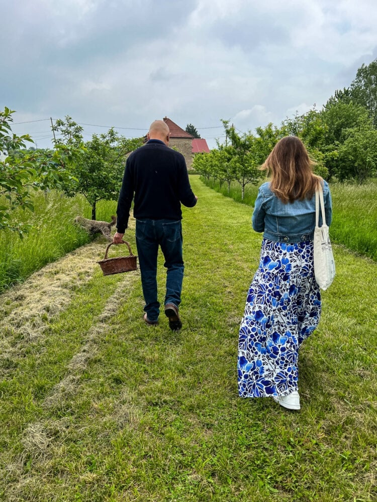 Rachelle walking with truffle farmer, Oliver Devevre, as he explains the symbiotic relationship between truffles and trees.