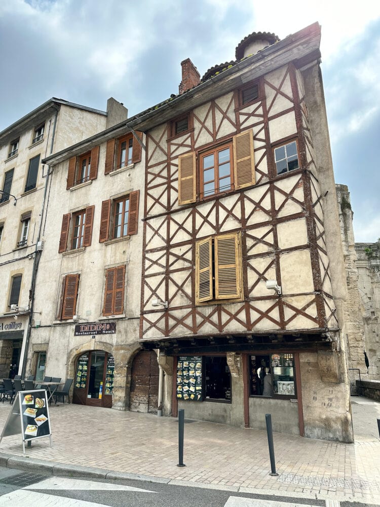 An example of 15th century half-timbered houses above shops in Vienne, France.
