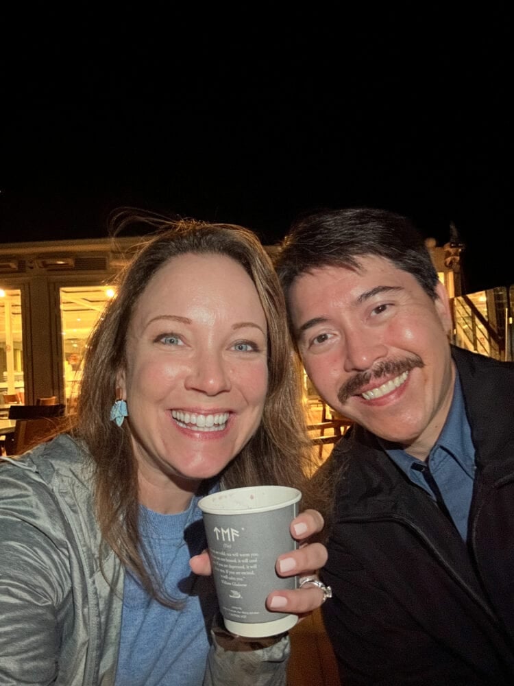 Rachelle and Pete sipping warm mulled wine on deck aboard Viking Hermod after an evening tour of Viviers.