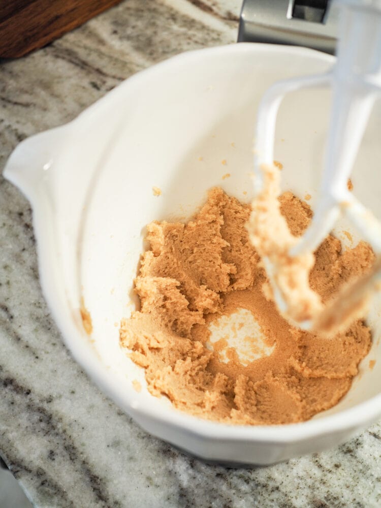 brown sugar and butter in a stand mixer bowl after being blended together