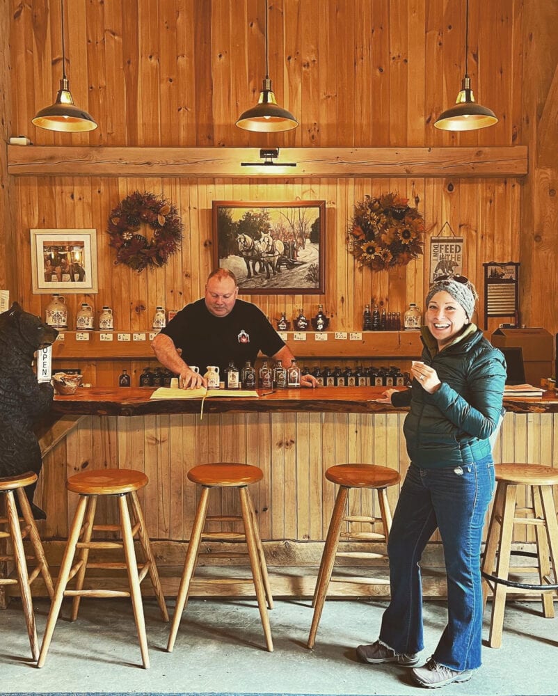 Rachelle tasting maple syrup at Wyckoff maple sugar house.