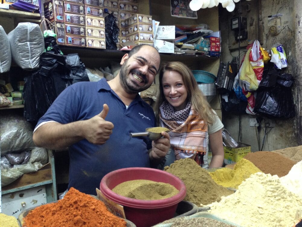 Rachelle with shop keeper in spice market in Jordan