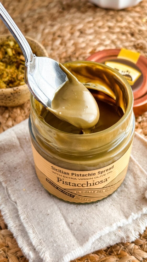 Jar of Sicilian Pistachio spread with spoon.