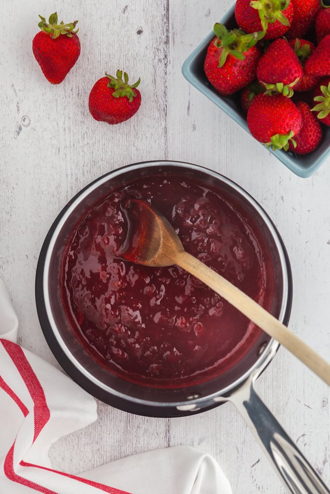 saucepan filled with strawberry sauce