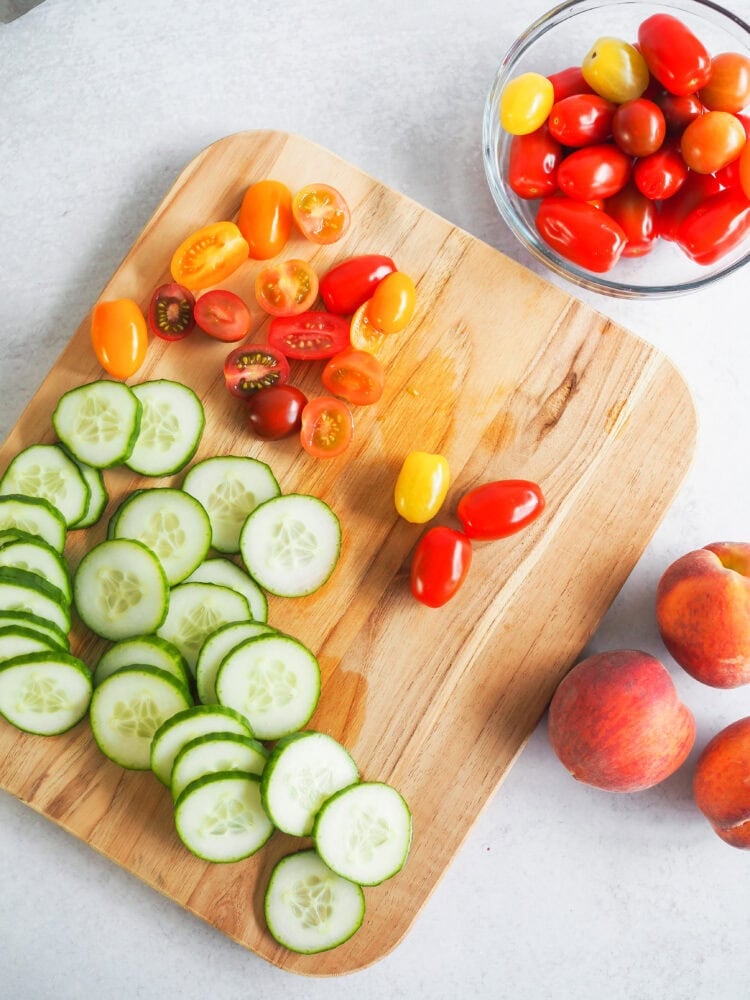 sliced vegetables on a wood cutting board
